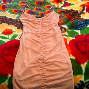 I am selling a size 2 light pink dress from pretty little things